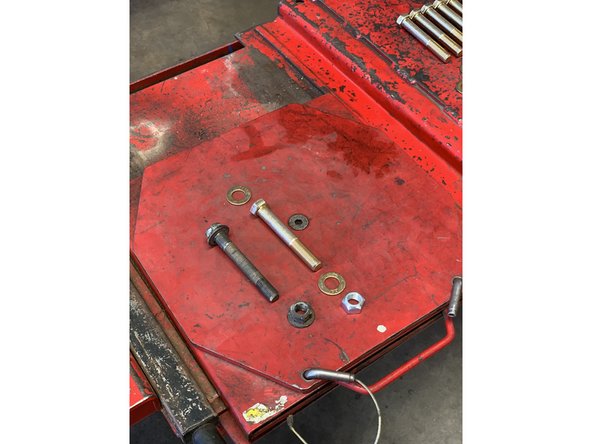 Remove one bolt at a time and replace with a 9/16-18 x 4&quot; bolt and lock nut with washers under the head of the bolt and lock nut.