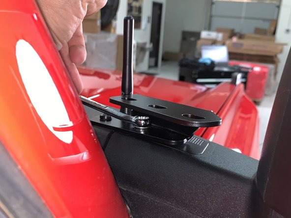 Install the light brackets to the vehicle reusing the inner T27 screw and using the provided M6 bolt for the outer hole.