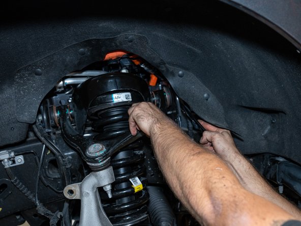 Upper and lower control arm bolts should be installed but still loose at this point. They need to be torqued only when the truck is under it's own weight.