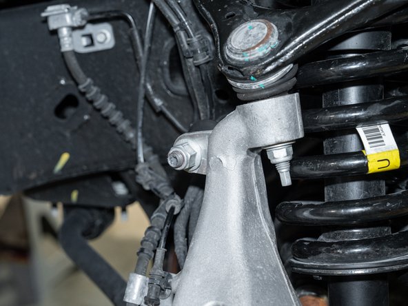 Reconnect upper sway bar link to knuckle.