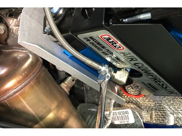 Install one end of the included Stainless Steel Pressure Hose on to the previously installed fitting on the compressor.