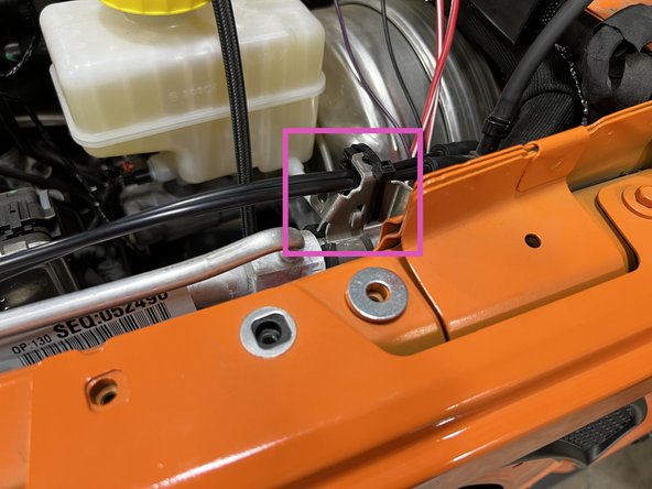 Remove the fender bolt shown with a 10mm wrench/socket.