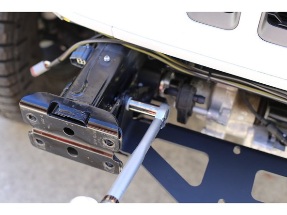 Make sure the skid plate mounting plates are correctly positioned and pushed up against the frame horns. Snug up lower mounting hardware.