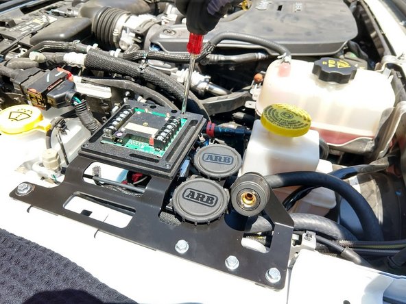 Connect the power wires to the sPOD module, noting that the circuit breaker is installed at the battery end. Use a 3/8" socket or wrench to tighten.