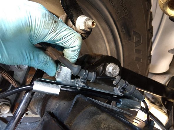 Re-clip the wheel speed senor wire to the axle side brake line retention bracket, and zip tie the sensor wire to the brake line in the appropriate locations to prevent damaging the speed sensor wire at full droop.