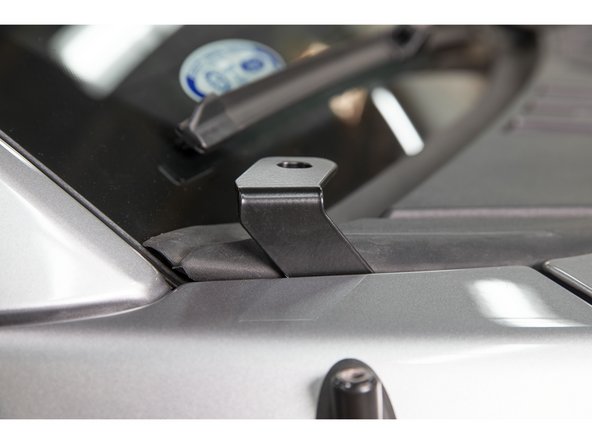 The bracket should angle back towards the rear of the vehicle as shown in image 2.