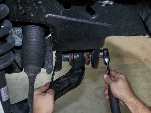 If the install is being done on floor jacks, it is near impossible to tighten the control arm bolts with the wheels on while lining up the lower control arm alignment marks from earlier.