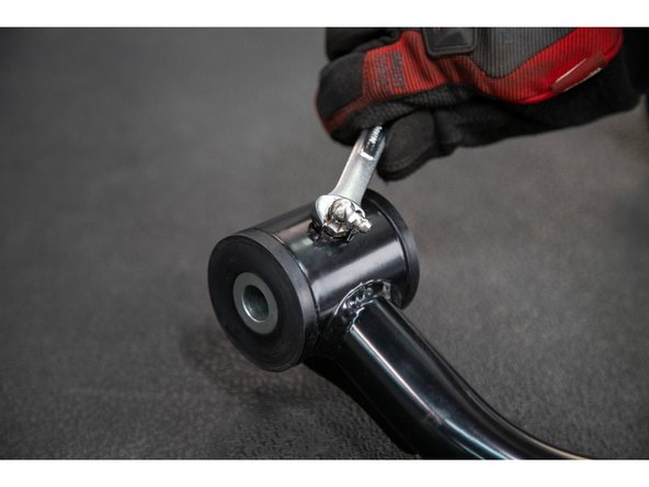 Apply grease to the inside of the upper control arm pivot tubes and insert the Pivot Sleeves with Load Rings into the arms.