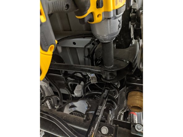 Move onto the rear frame side track bar mount