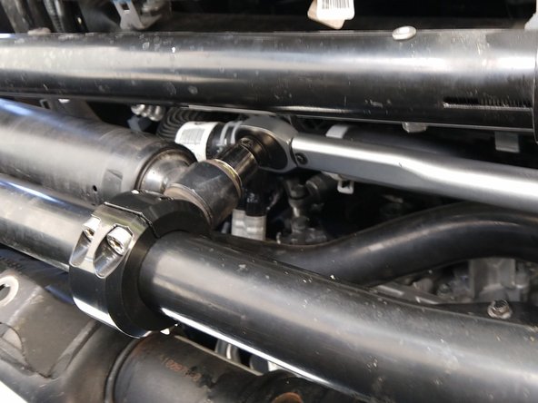 Torque the clamp screws to 25 lb-ft [34 Nm] with a T45 torx driver in an alternating pattern, trying to keep the gap between the halves equal.