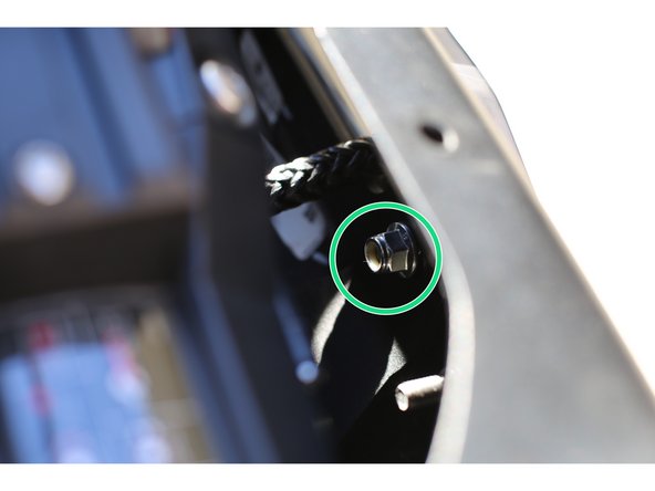Thread the winch rope/cable though the chosen fairlead. Using one of the provided M10-1.50 x 50mm stainless button head screws with a washer under the head, place the bolt though the fairlead, Fairlead Plate, front bumper, and Winch Plate. Use a provided flange nut on the backside. Tighten the nut one or two turns only at this time.