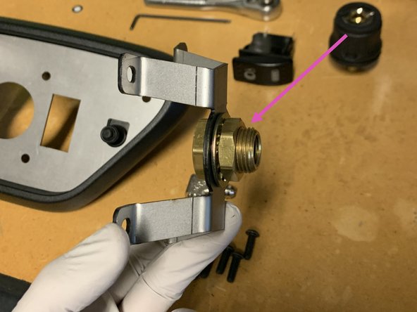 The Bulkhead Bracket Assembly should come with the brass bulkhead fitting pre-installed. Make sure the brass bulkhead fitting is oriented the correct direction as shown in the image. If it is installed backwards, there will not be room to close the 4XE door when fully assembled.