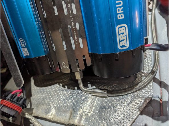 The ARB CKBLTA12 Twin Compressor comes with two wire harnesses and a power lead. The thicker harness is the main power harness and will be used to power the compressor. The other harness is the control harness and will be replaced by the included Grimm OffRoad control harness.