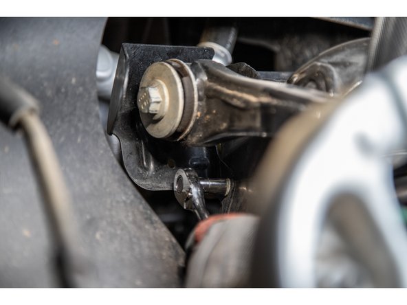 The upper control arm will have some bushing preload and will want to 'pop' up.