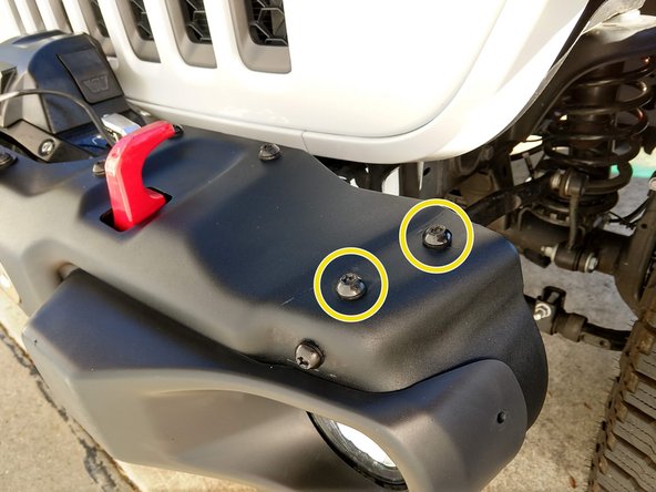 After identifying the left and right brackets, use a T45 torx driver to remove the 2 factory bolts on the top of the bumper, as shown. The bumper shown has had the outer 'wings' removed. Installation is the same if the wings are still in place.