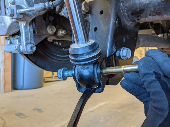 The lower eyelet of the shock will need to be supported before removing the shock bolt to prevent the shock from extending and coming out of the mount. With Nitrogen charged shocks it can be very difficult to get the shock back into the mount.