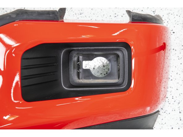 Insert the Grimm OffRoad fog light bracket into the fog light pocket making sure that the larger hole in the back of the bracket is on top.