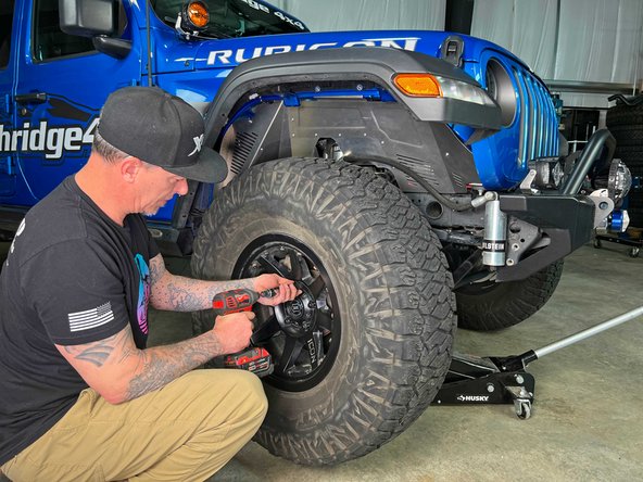 Re-install the front wheel/tire and put the vehicle back on the ground.