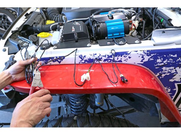 If you are going to install the ARB twin compressor with the ARB switches, route the switch harness in through the firewall to the dash and wire according to the ARB instructions.