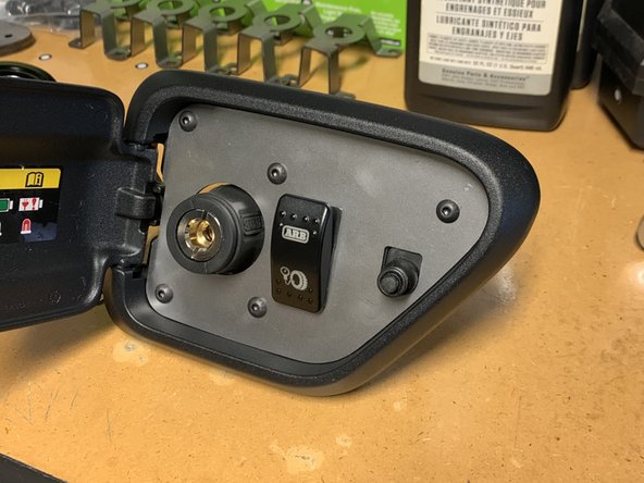 Push the ARB switch into the bracket until you hear it snap into place.