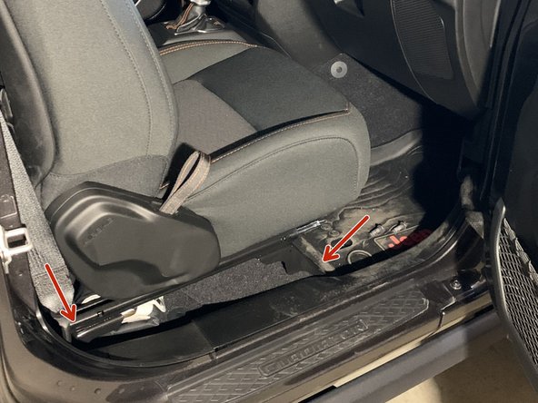 Locate the grommet in the floor and remove. This is where the ARB power harness will eventually be routed.