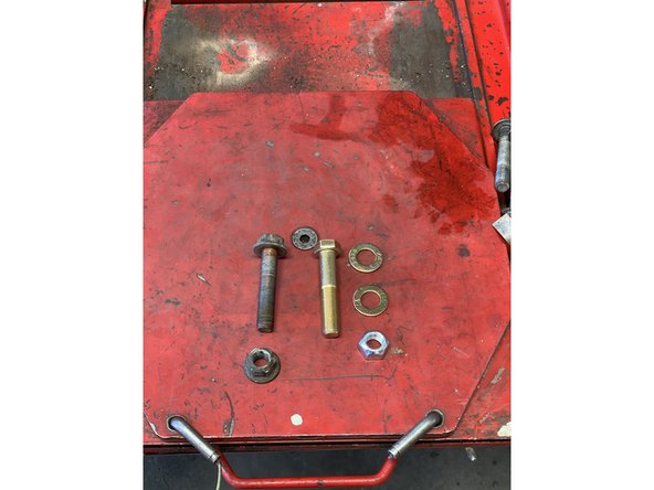 Make sure to hold onto the track bar so it doesn't drop out of the bracket.