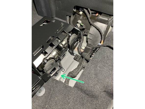 To seal the hole in the floor from the grommet removed earlier, cut a hole in the grommet for the wires to pass through and reinstall.