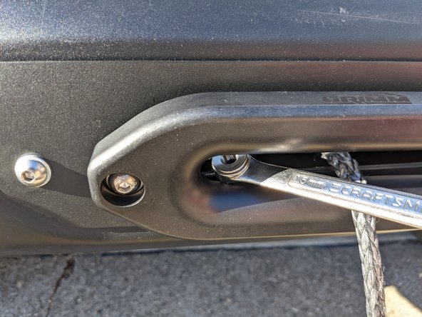 Insert hardware through the other side of the fairlead and install nut on backside.