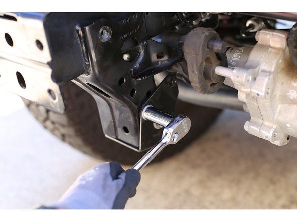 Using a 16mm socket remove the 2 bolts on the inside of each frame rail that hold the skid plate mounting plates on. Place the skid plate mounting plates close by, they will be re-used.