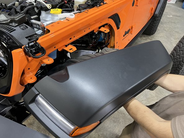 Re-install fender flare, replacing any retaining clips broken during removal.