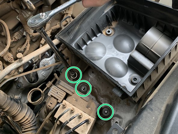 Remove the M8 bolt on the outside of the airbox securing it to the inner fender and remove the two nuts securing the ABS Module with a 12mm socket/wrench.