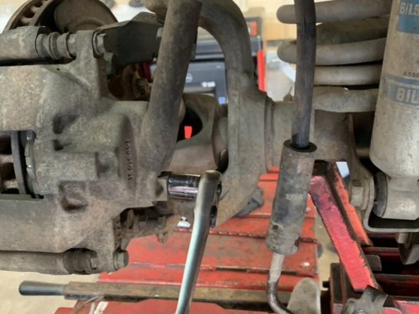 Save the banjo bolt, but discard the factory brake line and crush washers.