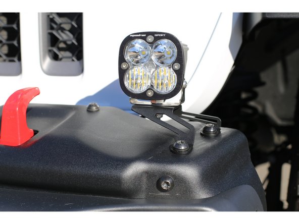 Aim the lights, then torque light mounting hardware to manufacturers spec.