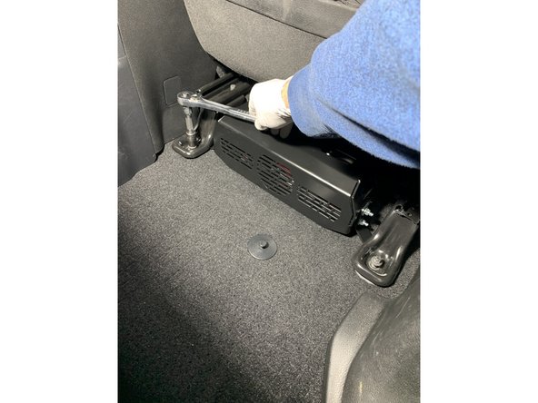 Reinstall the seat and install the rear seat bolts through the seat bracket and the compressor bracket mounting holes with an E12 Torx socket.