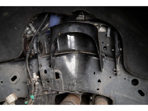 Remove the stock upper control arms.