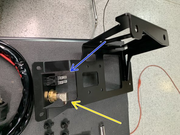 Install the 90 degree 1/4” NPT x JIC4 fitting into the back of the bulkhead fitting on the Compressor Mounting Bracket Assembly using a 9/16&quot; open end wrench. Use thread sealant on the NPT threads.