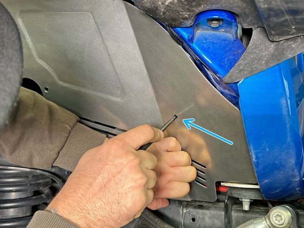 Position the front inner fender liner section into place and install two of the provided M6 screws, with a washer under each screw head. The screws should go through the fender flare, the fender sheet metal, and then into the clip barrel nuts.