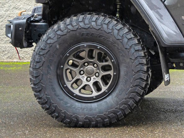 Re-install wheels and put vehicle back on the ground.