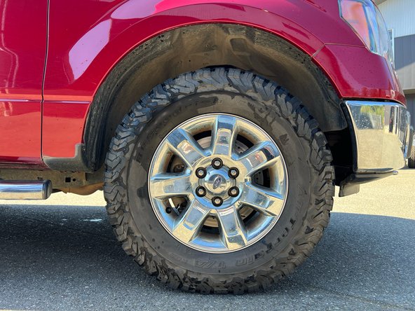 Re-install wheels and put vehicle back on the ground.