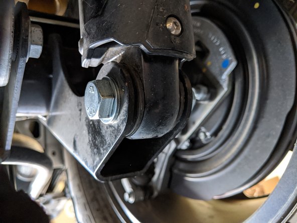 With a 21mm wrench/socket, loosen the stock bolts and nuts but do not remove yet.