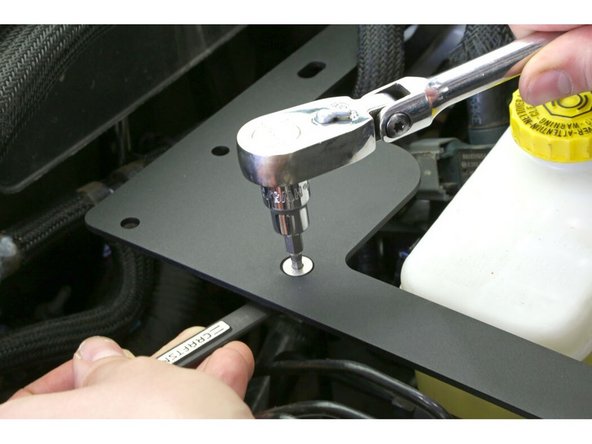 Install the M8 x 25mm hex head bolt, washer, and star washer into the rivet nut with a 13mm wrench and reinstall the original 10mm fender bolt into the rearward hole. Snug these up but do not fully tighten yet.