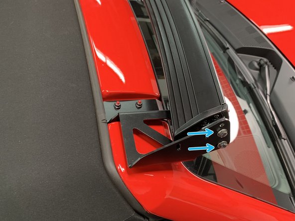 Attach the brackets to the light bar but leave the light bar hardware loose for now.