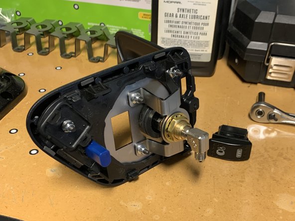 Insert the five M5x0.8 16mm Hex Drive Button Cap Screws through the Base Plate from the front and secure with the M5x0.8  Flanged Nylocks on the back.