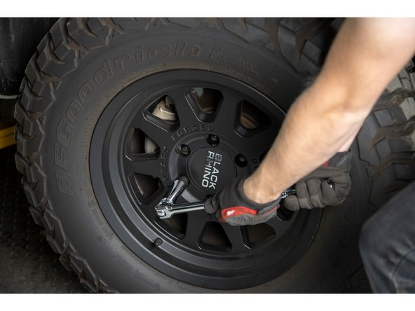 Re-install wheels and put vehicle back on the ground.