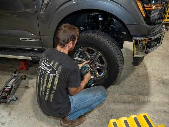 Reinstall wheels and torque lug nuts to 150 lb-ft (203 Nm).