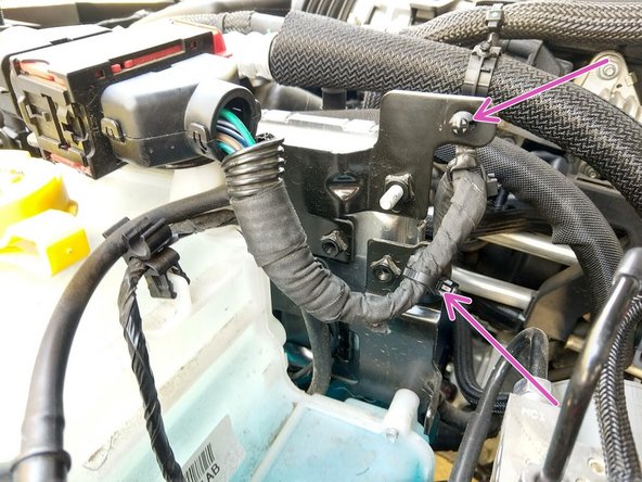 Install new zip ties through the clips, and install the clips back as shown.