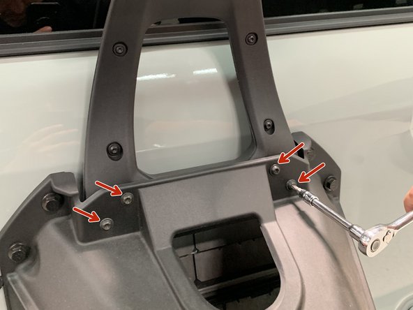 Remove the four screws securing the 3rd Brake Light Bracket using a T30 Torx bit.