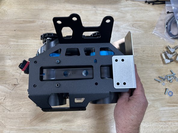 Follow the ARB Brushless Twin Compressor (CKBLTA12) instructions to get the compressor setup for use. This involves adjusting the clamping mechanism, removing the plastic dust plugs from the ports, and installing the pressure switch.