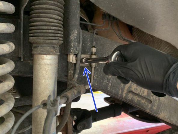 Remove the factory brake line bracket from the frame using a 10mm socket or wrench.