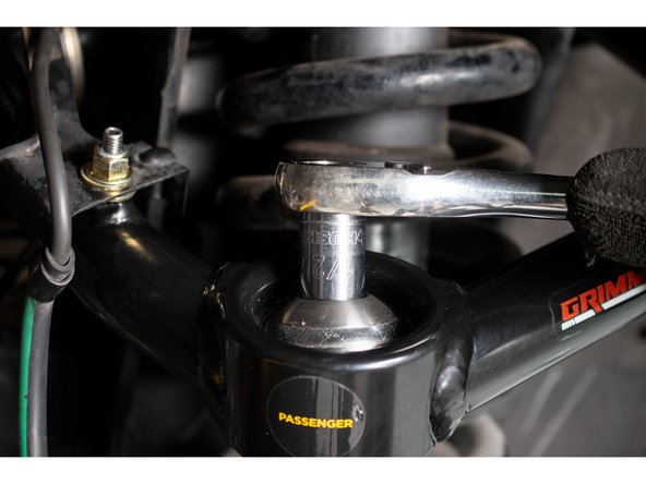 Remove the 1/2-20 12 point cap screws from the top of the uniballs.  Apply provided threadlocker to the threads, and re-install.